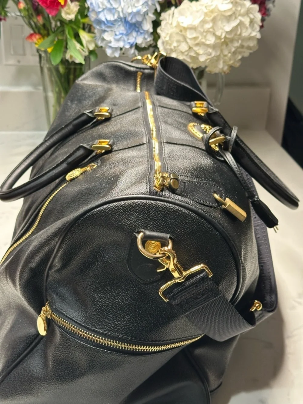 Versace Unisex Black Leather Duffel with Gold Medallion